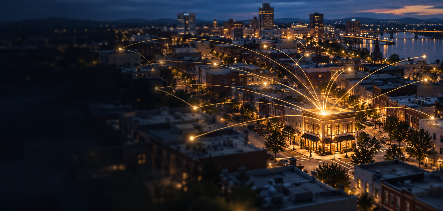 Night-time city with golden AI connection lines converging on a lit local storefront